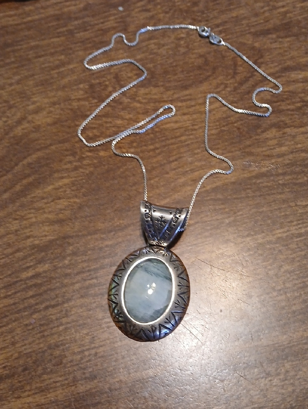 Sterling Silver Pendant Necklace with Pale Blue Oval Stone